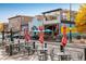 Charming restaurant outdoor seating with colorful umbrellas and blooming flower boxes at 722 Hutchinson St, Louisville, CO 80027