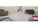 Open basement with play area and seating; ready for entertaining and relaxation at 9140 Moondance Dr, Littleton, CO 80125
