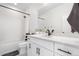 Elegant bathroom with a shower-tub combination, a white vanity with black hardware, and modern fixtures at 9140 Moondance Dr, Littleton, CO 80125