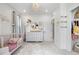 Charming Bedroom featuring a crib, dresser, and ample storage, creating a functional and stylish space at 9140 Moondance Dr, Littleton, CO 80125