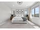 Bright main bedroom with carpet, neutral walls, and large windows at 9140 Moondance Dr, Littleton, CO 80125