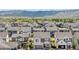 Aerial view showcases neighborhood and stunning mountain views at 9140 Moondance Sw Dr, Littleton, CO 80125