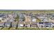 Extensive aerial view of neighborhood community with lake views in background at 9140 Moondance Sw Dr, Littleton, CO 80125