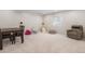 Finished basement area with playroom, dining table, and seating area offers versatile living space at 9140 Moondance Sw Dr, Littleton, CO 80125