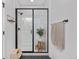 Modern bathroom with white subway tile shower and glass enclosure, plus stylish accessories at 9140 Moondance Sw Dr, Littleton, CO 80125