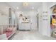 Bright, cheerful Bedroom with charming decor, a stylish chandelier, and ample closet space at 9140 Moondance Sw Dr, Littleton, CO 80125