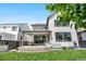 Exterior showcasing covered patio, sliding glass doors and backyard at 9140 Moondance Sw Dr, Littleton, CO 80125