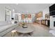 Open-concept living area featuring a gourmet kitchen and dining space at 9140 Moondance Sw Dr, Littleton, CO 80125