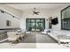 Covered patio features an outdoor seating area, ceiling fan, and sliding glass doors to the interior at 9140 Moondance Sw Dr, Littleton, CO 80125