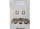 Dedicated pet area with custom feeding station and charming dog-themed artwork at 9140 Moondance Sw Dr, Littleton, CO 80125