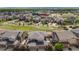 Aerial view of a neighborhood with well-maintained homes, green spaces, and community amenities at 2820 Macon Way, Denver, CO 80238