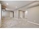 Spacious finished basement featuring neutral carpet, recessed lighting, and multiple doorways at 2820 Macon Way, Denver, CO 80238