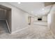Finished basement with carpet, ample lighting, storage and a bathroom at 2820 Macon Way, Denver, CO 80238