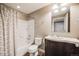 Cozy bathroom with tub-shower combo, vanity with storage, and neutral color scheme at 2820 Macon Way, Denver, CO 80238