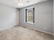 Bedroom with neutral paint and a bright window at 2820 Macon Way, Denver, CO 80238