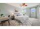 Comfortable bedroom featuring a ceiling fan, large windows, and stylish decor at 2820 Macon Way, Denver, CO 80238