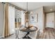 Dining area with modern lighting fixture that features natural light from the sliding glass door to the patio at 2820 Macon Way, Denver, CO 80238