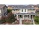 Home exterior with manicured front yard, covered porch, and brick accents at 2820 Macon Way, Denver, CO 80238