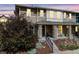 Two-story home showcases a covered front porch, nice paint scheme, and mature landscaping at 2820 Macon Way, Denver, CO 80238