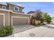 Exterior view of home with garage, driveway, and manicured landscaping at 2820 Macon Way, Denver, CO 80238