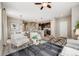 Open-concept living space features hardwood floors, modern furniture, and staircase at 2820 Macon Way, Denver, CO 80238