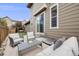 Relaxing outdoor patio with furniture and neutral decor, perfect for entertaining or lounging at 2820 Macon Way, Denver, CO 80238
