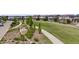 Attractive street view of lush greenway with homes in the background in a well-maintained community at 2820 Macon Way, Denver, CO 80238