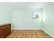 Bright bedroom with hardwood floors, a window, and plenty of natural light at 6906 S Sycamore St, Littleton, CO 80120
