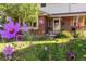 Cozy home exterior with garden and blooming flowers at 6906 S Sycamore St, Littleton, CO 80120