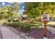 Landscaped front yard featuring rock beds and lush green grass at 6906 S Sycamore St, Littleton, CO 80120