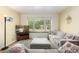 Cozy living room with large window and comfortable sectional sofa at 6906 S Sycamore St, Littleton, CO 80120