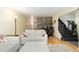 Spacious living room showcasing fireplace, hardwood floors, and comfortable seating at 6906 S Sycamore St, Littleton, CO 80120