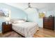 Comfortable main bedroom with a ceiling fan, hardwood floors, and windows for natural light at 6906 S Sycamore St, Littleton, CO 80120
