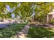Neighborhood street view with mature trees and sidewalks at 6906 S Sycamore St, Littleton, CO 80120