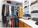 Walk-in closet offers ample storage with shelving, drawers, and hanging rods at 6906 S Sycamore St, Littleton, CO 80120
