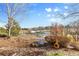 Scenic backyard view showing professional landscaping and mature trees at 7882 Vallagio Ln, Englewood, CO 80112