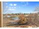 Backyard view of a golf course and open space at 7882 Vallagio Ln, Englewood, CO 80112