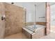 Elegant bathroom with soaking tub and walk-in shower at 7882 Vallagio Ln, Englewood, CO 80112