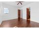 Bedroom with hardwood floors and access to bathroom at 7882 Vallagio Ln, Englewood, CO 80112