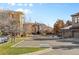 Exterior view of community buildings with parking space and well-maintained landscaping at 7882 Vallagio Ln, Englewood, CO 80112