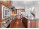 Modern kitchen with ample cabinetry and hardwood floors at 7882 Vallagio Ln, Englewood, CO 80112