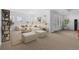 Sun-drenched living room featuring large windows and cozy seating arrangement at 7882 Vallagio Ln, Englewood, CO 80112