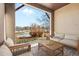 Relaxing outdoor patio with seating area, offering views of well manicured landscaping at 7882 Vallagio Ln, Englewood, CO 80112