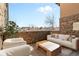 Cozy patio with stone accents, perfect for outdoor seating and relaxation at 7882 Vallagio Ln, Englewood, CO 80112
