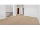 Upper floor landing with high ceilings and bookcase at 7882 Vallagio Ln, Englewood, CO 80112