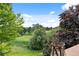 Scenic view of the golf course and greenery from a balcony at 7882 Vallagio Ln, Englewood, CO 80112