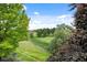 Picturesque golf course view from the outdoor patio with lush greenery at 7882 Vallagio Ln, Englewood, CO 80112