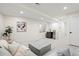 Finished basement with a cozy sectional sofa and convenient wet bar with a sink at 1727 Lowell Blvd, Denver, CO 80204