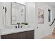 Stylish powder room with modern vanity, mirror, artwork, and sleek fixtures at 1727 Lowell Blvd, Denver, CO 80204