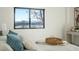 Cozy bedroom with scenic water views through a large window and a comfortable bed at 1727 Lowell Blvd, Denver, CO 80204